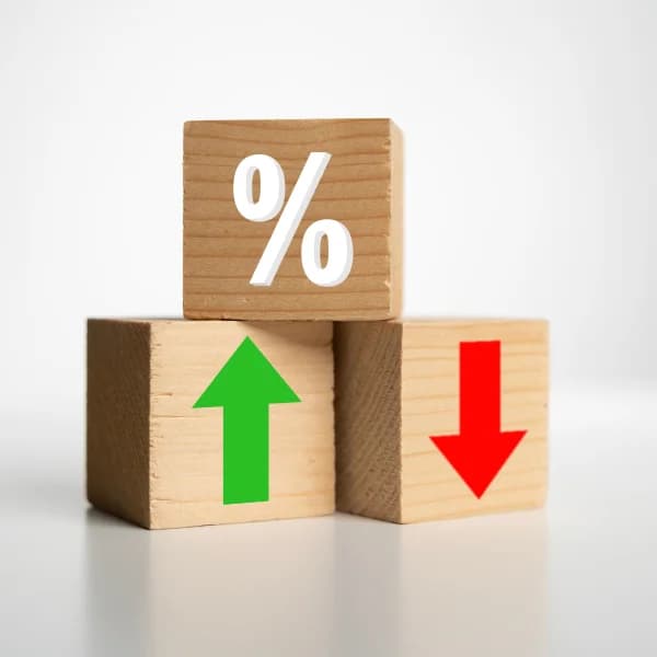 Three wooden blocks with arrows pointing up and down, symbolizing rapid movement or change.